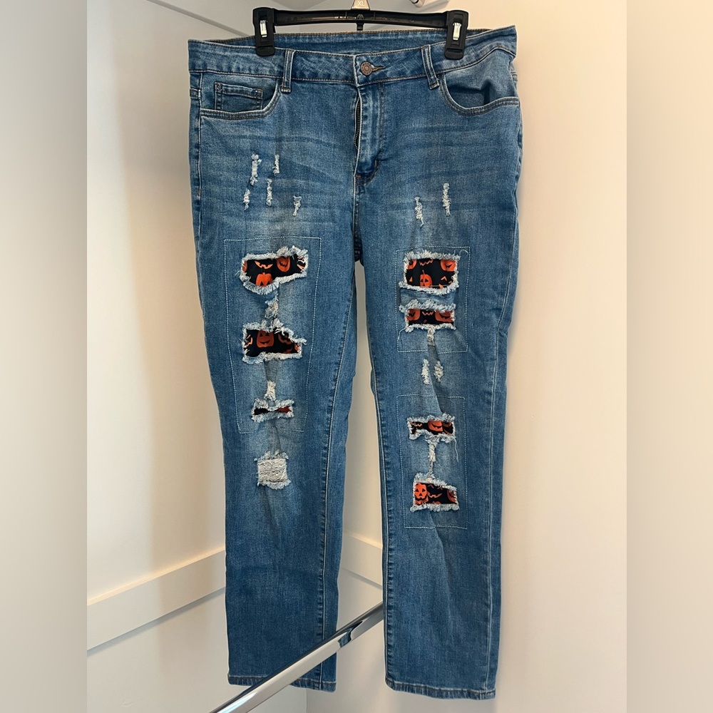 Distressed Blue Jeans with Patterned Accents